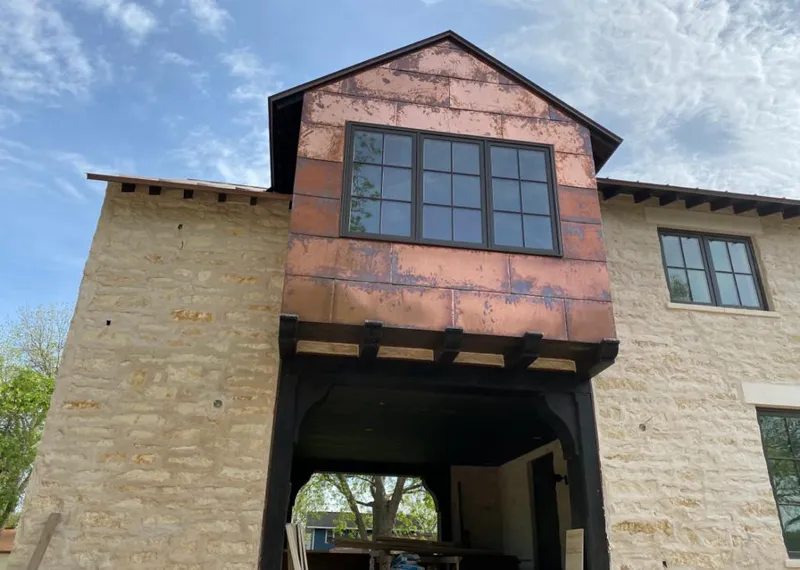 Copper metal panel facade on a stone building for Roof Repair in Bullhead City